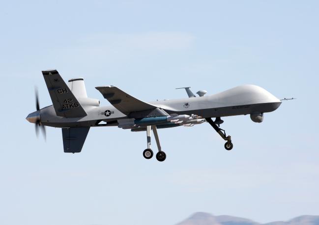 A MQ-9 Reaper flies above Creech Air Force Base, Nev., during a local training mission June 9, 2009. The 42nd Attack Squadron at Creech AFB operates the MQ-9.  (U.S. Air Force photo/Paul Ridgeway)
